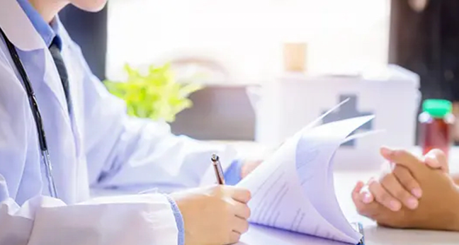 Doctor reviewing patient paperwork, a healthcare use case for continuous scanning
