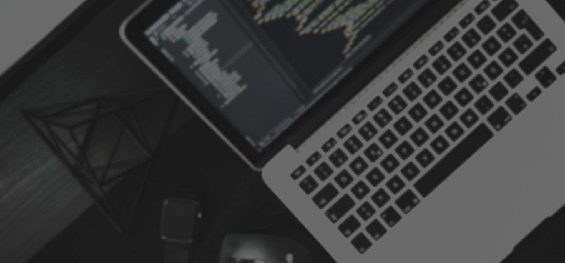 Darkened top view of a laptop showing code, Pool Digital story cover
